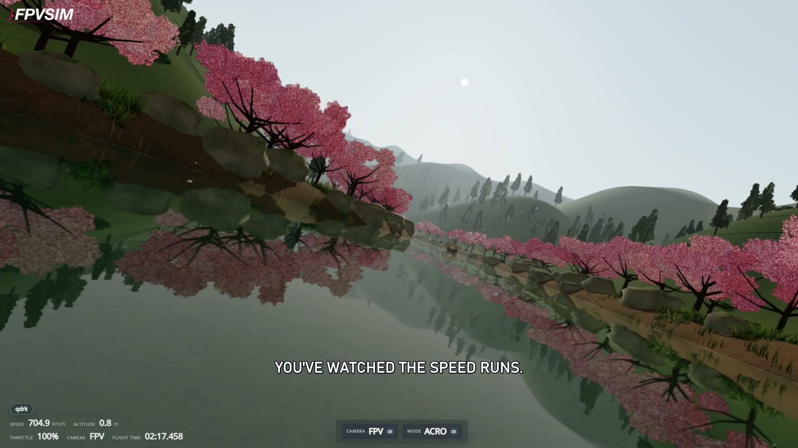 An FPV view just above the water in FPVSIM, with cherry trees along the banks and a simulated 704.9 km/h speed readout.